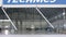 Roller shutter door and concrete floor of airport hangar and airplane background. Airport hangar from the outside with