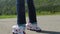 Roller-skater. Close-up shot of female legs in inline skates moving on walking path. Slow motion. HD