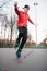 Roller skater legs in skates on asphalt walkway