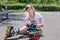 Roller skater looking at her bruised arm