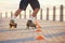 Roller skates, sport and feet with a man riding around cones for training, fitness and exercise on the promenade by the