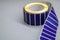 Roller tape blue self-adhesive label. Material for printing and marking products. Thermal label. Selective focus, copy