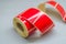 Roller tape red self-adhesive label. Material for printing and marking products. Thermal label. Selective focus, copy