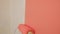 roller wall painting peach orange color closeup