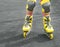 Rollerblades inline skates of a child closeup in action outdoors