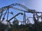 Rollercoaster silhouetted against a blue sky