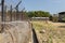 Rollers of razor barbed wire and elctrical fence around Phu Quoc Prison, Vietnam