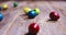 Rolling Easter quail eggs on wooden surface, close up festive video. Christian religious celebrating tradition