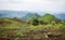 Rolling fertile hills with fields and crops on Ring Road of Cameroon, Africa