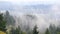 Rolling fog and low clouds over suburb landscape and residential homes in Happy Valley Oregon