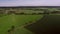 Rolling hills, meadows, farmlands in the Netherlands Aerial View