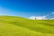 Rolling hills with trees and blue skies, Tuscany, Italy