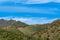 Rolling hillsides in sabino national park in the cliffs and hills of tuscon arizona in the late afternoon shade with blue sky