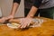 Rolling out cookie dough with a wooden splinter on the table