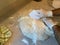 Rolling out and Dividing up Homemade Bread Dough on a Floured Countertop Before Baking