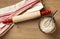 Rolling pin with classic red and white striped cotton dish towel