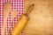 Rolling pin with wooden spoon on a wooden board