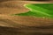 Rolling Plowed Field on Farm with Furrow Marks and Rows Texture