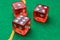 Rolling red dice green surface