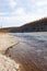 Rolling on the Siberian taiga river during autumn fishing