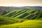 Rolling Tuscany hills in the golden hour