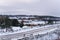 Rolling Winter Landscape under Cloudy Sky