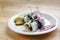 Rollmops or rolled pickled herring with red onions, gherkins and capers, a sour hangover breakfast for example on Ash Wednesday on