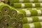 Rolls artificial grass in store of building materials.