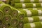 Rolls artificial grass in store of building materials.