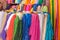 A Rolls of brightly coloured fabrics and cloths