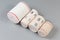 Rolls of different woven elastic medical bandages with clips