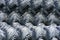 Rolls of galvanized steel wire mesh with a large cell and twisted pattern close-up. In the category of texture, screen