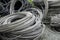 Rolls of metal or steel cables used for electric poles at an industrial yard