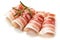 Rolls of pancetta bacon isolated on white