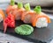 Rolls with salmon scorched by fire. With avocado and salmon caviar