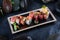 Rolls with smoked salmon, eel and tuna.Rolls Kaisen. Avocado inside rolls.Dark background.Vegetarian food. Traditional