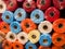 Rolls of textured decorative wrapping paper of different colors on the shelf in the store