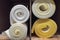 Rolls white and yellow foam rubber building material texture. Polystyrene sealing foam surface background