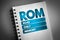ROM - Read Only Memory acronym on notepad, technology concept background