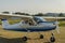 ROMA, ITALY - AUGUST 2018: An experienced pilot and a little girl child at the helm of a light-engine aircraft Tecnam P92 Echo