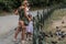 ROMA, ITALY - AUGUST 2018: Happy family feeds ducks and pigeons in a city park