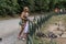 ROMA, ITALY - AUGUST 2018: Happy family feeds ducks and pigeons in a city park