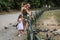 ROMA, ITALY - AUGUST 2018: Happy family feeds ducks and pigeons in a city park