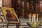 ROMA, ITALY - AUGUST 2018: Icon of the Mother of God with Jesus near burning candles in Basilica di Santa Maria in Trastevere