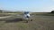 ROMA, ITALY - AUGUST 2018: The pilot starts the propeller on a light-engine aircraft before take-off at a ground-based airport