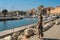 ROMA, ITALY - AUGUST 2018: Young beautiful girl walks in the port near luxury yachts