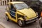 Roma, Italy - January 04, 2012: Yellow mini car Ligier Be Two, ATV, city subcompact with diesel engine, automatic transmission.