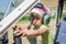 ROMA, ITALY - JULY 2017: Little charming little girl pilot, child in the cockpit of light-engine aircraft Tecnam P92-S Echo