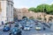 Roma, Italy - October 2015: A large crowd of pedestrians tourists passes through a pedestrian crossing a busy street with traffic