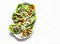 Romaine salad stuffed with tuna, egg, tomato, avocado salad on a light background, top view. Delicious appetizer, tapas, snack